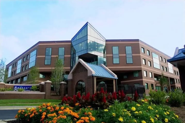 Front building view of the Michigan State University College of Human Medicine with the name of the school and school logo on the font of the building.