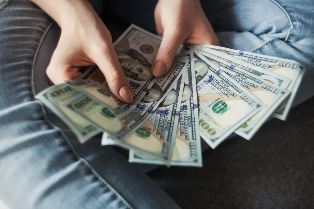 Person holding money fanned out